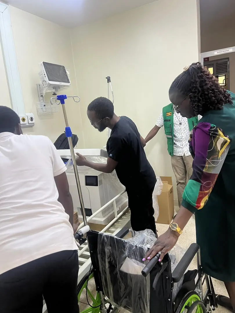 Clinical team inspecting medical equipment during handover and orientation